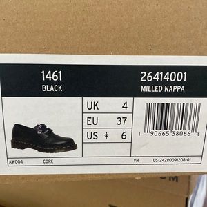 Dr.Martens Black Leather Shoes size 6 with iridescent metal lace hooks.